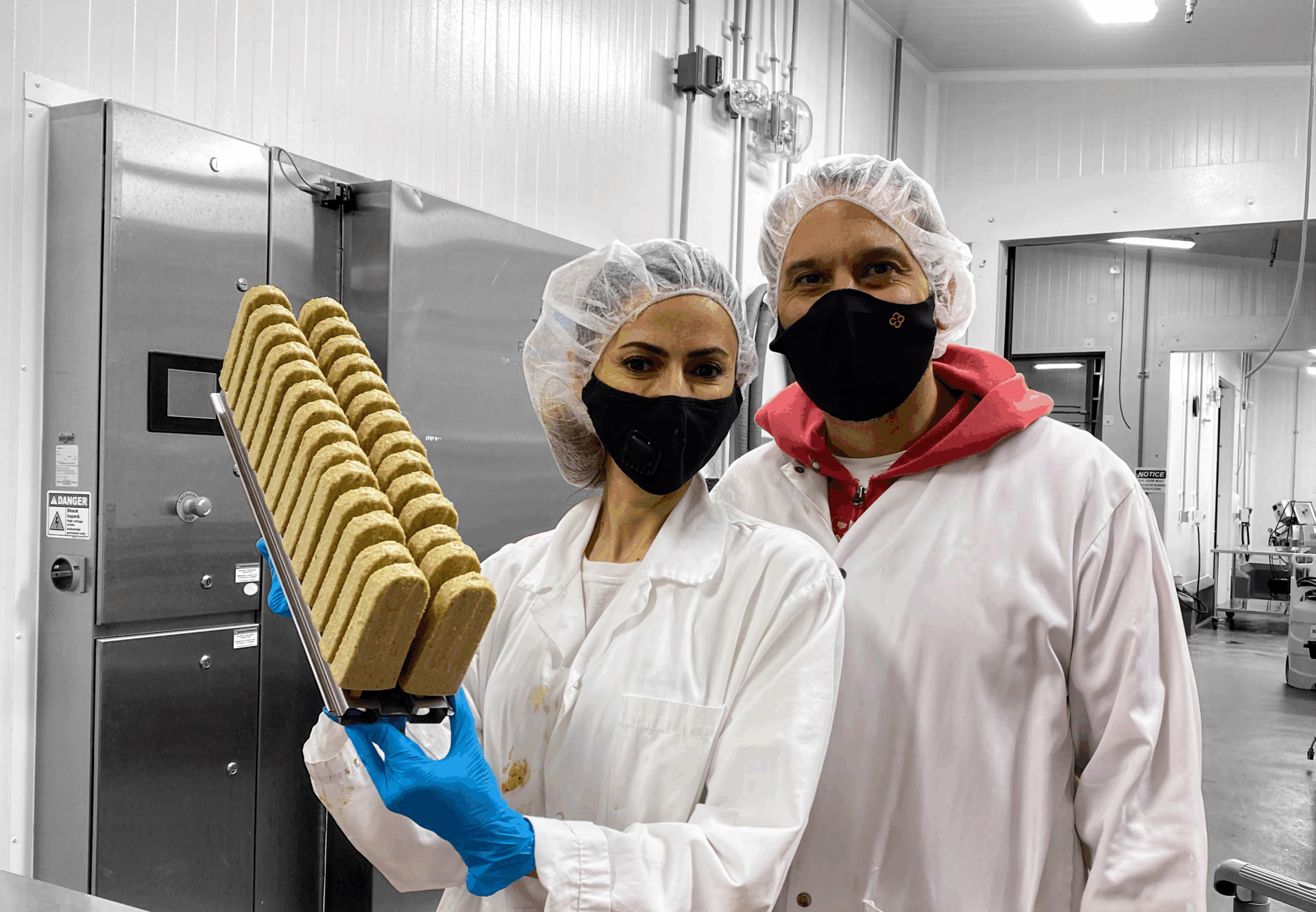 Clients hold up popsicles in molds